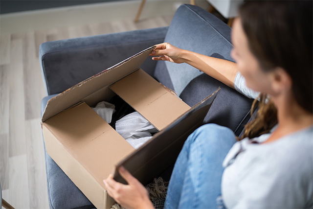 woman opening up a package