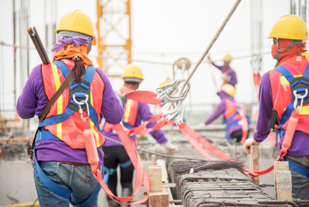 construction workers on a site demonstrating safe behaviors