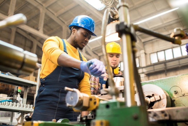 Two manufacturing workers working